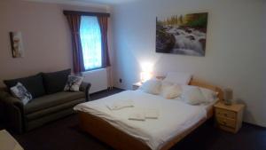 Posteľ alebo postele v izbe v ubytovaní Hotel Garni Belveder