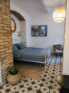 a bedroom with a bed in the corner of a room at Studio apartment Frano in Zagreb