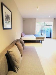 Posteľ alebo postele v izbe v ubytovaní Mazi Apartments Suite