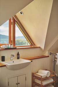 a bathroom with a sink and a window at Drovers Rest in All Stretton