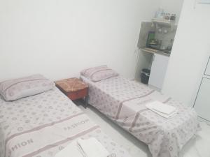 Katil atau katil-katil dalam bilik di Nitra rooms