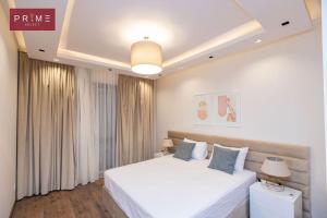 A bed or beds in a room at Prime Select West Sodic