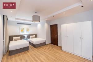 A bed or beds in a room at Prime Select West Sodic