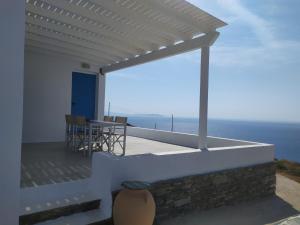 a view of the ocean from the balcony of a house at Sofia sea view apartment in Faros