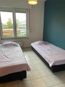 Postel nebo postele na pokoji v ubytování Superbe appartement lumineux et spacieux