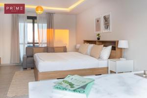 A bed or beds in a room at Prime Select West Sodic