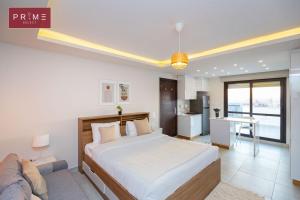 A bed or beds in a room at Prime Select West Sodic