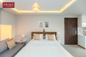 A bed or beds in a room at Prime Select West Sodic