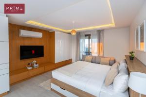 A bed or beds in a room at Prime Select West Sodic