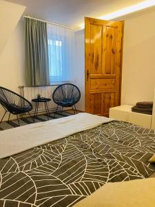 Posteľ alebo postele v izbe v ubytovaní Klebi’s apartmanház
