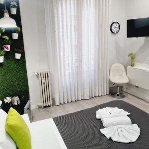 Postel nebo postele na pokoji v ubytování Hostal Lauria