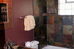 a bathroom with a tub and a sink and a toilet at Rocky Mountain Retreat 2 by Rocky Mountain Resorts in Estes Park