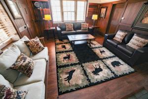a living room with a couch and a table at Aspen Mountain Lodge - #3357 in Estes Park