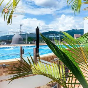 a view of the pool from the balcony of a building at Hotel Hacaritama Colonial in Villavicencio