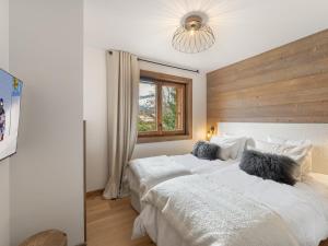 Posteľ alebo postele v izbe v ubytovaní Appartement spacieux avec accès bien-être, proche des pistes et du centre de Megève - FR-1-569-46
