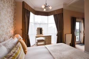 Ένα ή περισσότερα κρεβάτια σε δωμάτιο στο Avron House