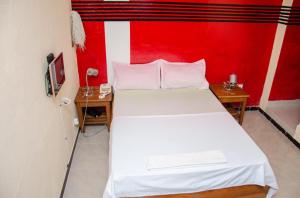 מיטה או מיטות בחדר ב-Kër Adja