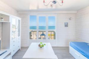Ένα ή περισσότερα κρεβάτια σε δωμάτιο στο Studio Centre belle vue mer