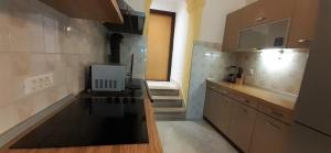 Kuchyň nebo kuchyňský kout v ubytování Apartments Dida moj