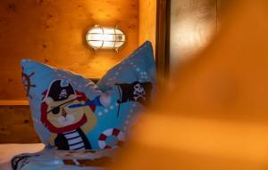 a pillow with a mickey mouse holding an umbrella at Landgasthof Paradies in Frickingen