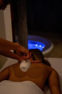 a woman getting her hair cut with a hair dryer at Masseria Filippo de Raho - Agri Bio Relais in Villa Convento