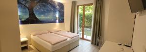 Postel nebo postele na pokoji v ubytování Agriturismo Vin e Amor