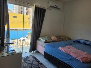 Giường trong phòng chung tại Casa de Praia