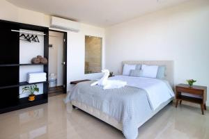 A bed or beds in a room at Amara, depa con vista al mar