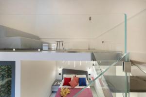a room with a bed and a glass wall at CASA LUCKY CENTRAL APARTMENT in Piano di Sorrento