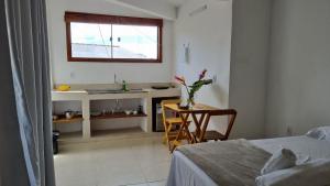 Postel nebo postele na pokoji v ubytování Vila Pitangueira - Flat Terra - No centro de Serra Grande com Piscina, Jacuzzi, Internet Veloz