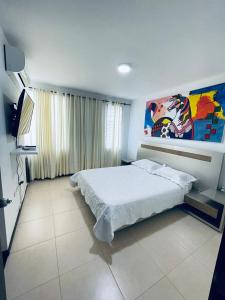 Postel nebo postele na pokoji v ubytování Casa completa con Aire Acondicionado, Calentador de Agua & Garaje privado