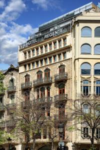 a large building with a hotel reservations sign on it at HCC Regente in Barcelona