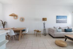 a living room with a couch and a table at Nice And Spacious Apartment In Paros in Naousa