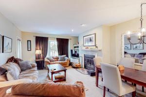 a living room with a couch and a table at Winterplace Condos K in Ludlow