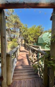 a wooden bridge over a body of water at DomosdeMar in Ocean Park