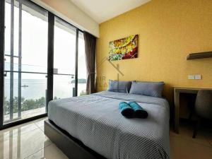 PD D'Wharf Duplex 3BR - Full Seaview (Up To 12 Pax)客房内的一张或多张床位