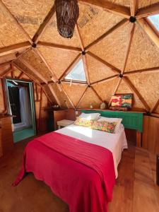 a bedroom with a large bed in a attic at DomosdeMar in Ocean Park