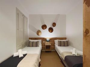 Postel nebo postele na pokoji v ubytování Stay U-nique Apartments Borbó + 12 fotografií