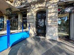 an entrance to a store with a blue door at Stay U-nique Apartments Borbó in Barcelona