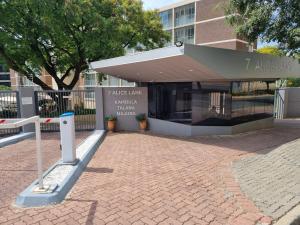 a building with a large entrance to a building at Walk frm Mandela Square, Sandton City and Gautrain in Johannesburg
