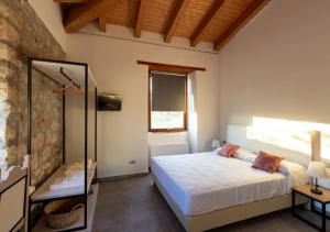 A bed or beds in a room at Tenuta San Martino