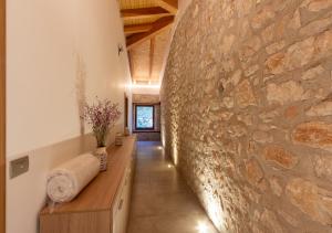 a hallway with a stone wall in a house at Tenuta San Martino in Nusco