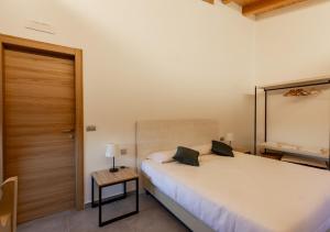 A bed or beds in a room at Tenuta San Martino