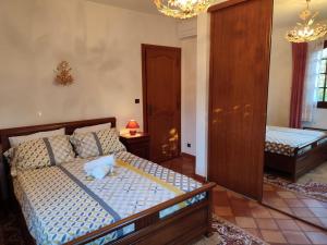 a bedroom with two beds in a room at Villa avec piscine privée in Allauch +40 photos