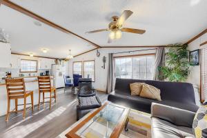 a living room with a couch and a table at Assateague Point Vacation in Berlin