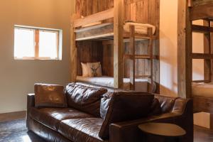 a living room with a couch and bunk beds at The Edelweiss Estate in Gatlinburg