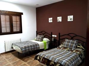 Postel nebo postele na pokoji v ubytování Villa Mariana