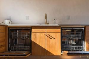 a kitchen with two dishwashers and a counter at The Edelweiss Estate in Gatlinburg