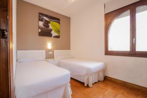 A bed or beds in a room at Casa Ancora by MarCalma