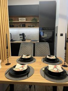 Een keuken of kitchenette bij Apartman Sara - DivčiNova